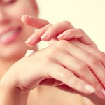 woman-applying-hand-cream-winter