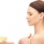 beautiful woman with moisturizing creme
