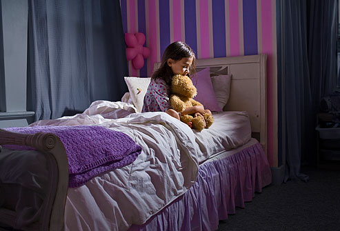 getty_rm_photo_of_little_girl_sitting_awake_at_night_with_worries