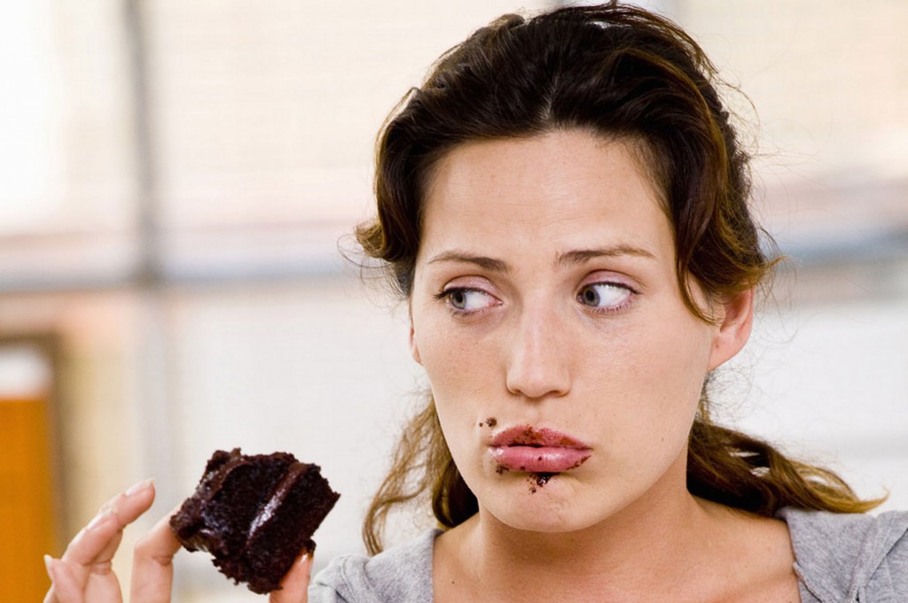 Woman eating chocolate cake