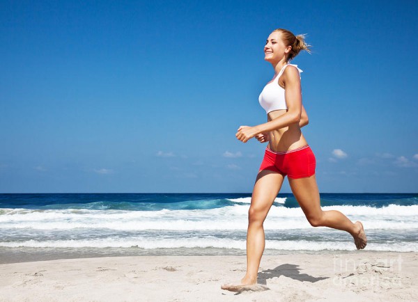 healthy-woman-running-on-the-beach-anna-omelchenko