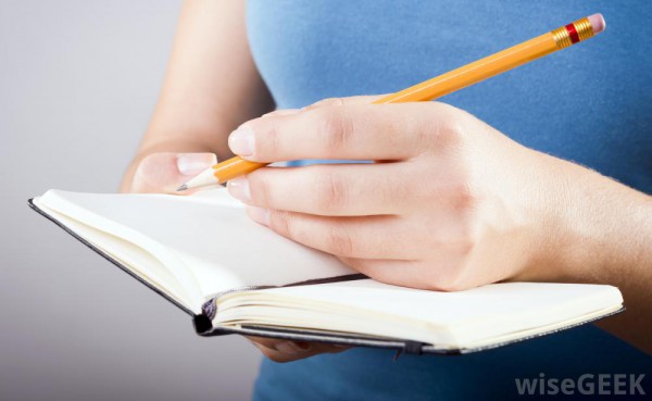 woman-in-blue-writing-in-journal