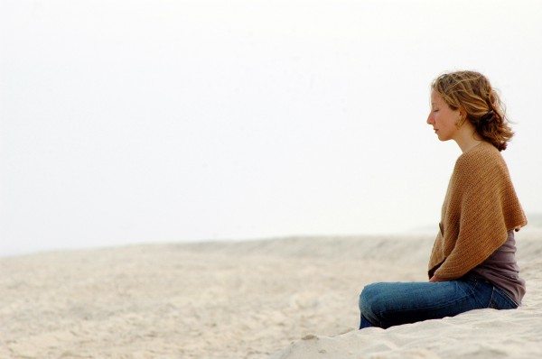 woman-meditating-beach