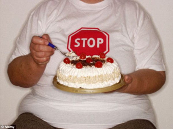 1412380763457_Image_galleryImage_An_Obese_woman_eating_cak