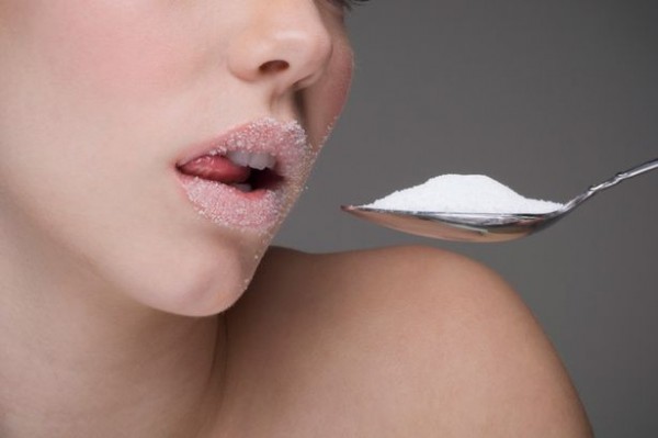 Woman-eating-spoon-of-sugar