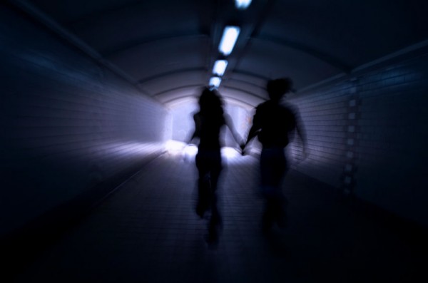 A man and a woman running away