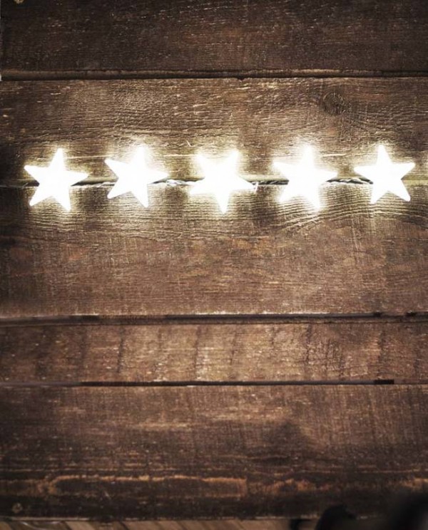 Christmas rustic background with lights and free text space. Festive vintage planked wood with c