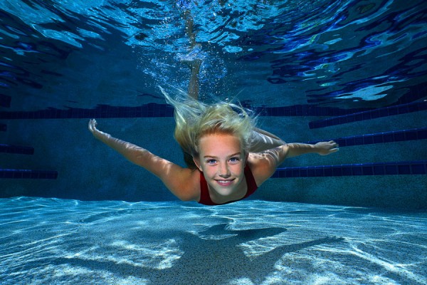 Young Girl Swimming Underwater