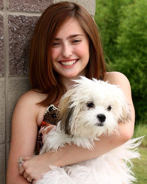 14658-a-cute-young-girl-posing-with-a-small-dog-pv
