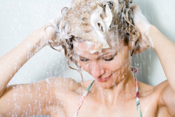 Woman washing her hair in the shower