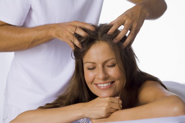 Woman having a scalp massage
