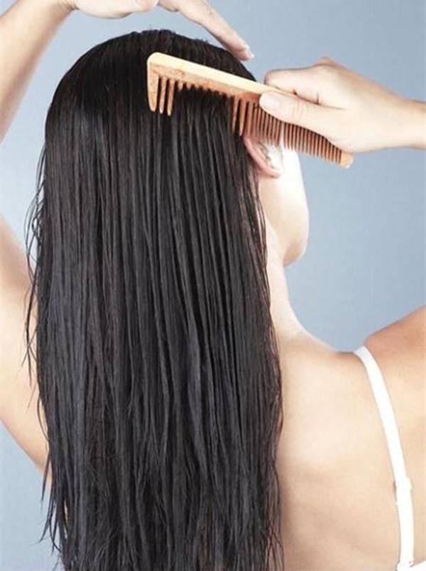 Woman combing hair