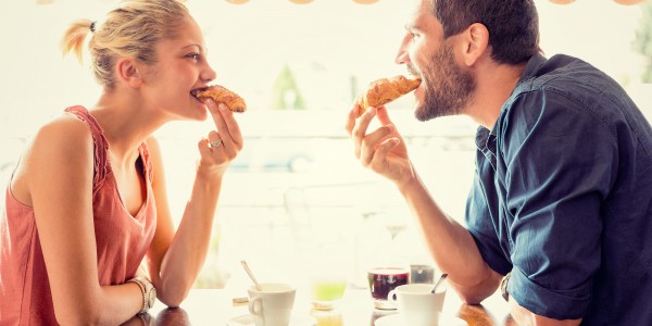 Young couple have breakfast at italian cafÃ©