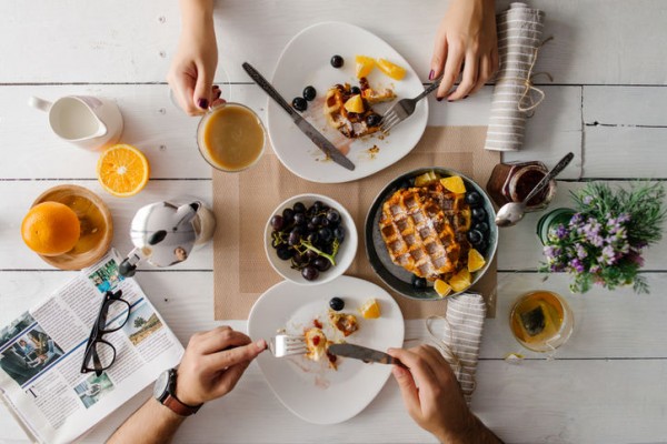 breakfast-couple-waffles-table-meal-coffee-tea-stocksy-w724