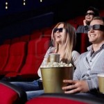 9326659-laughing-young-people-in-3d-glasses-watching-a-movie-at-the-cinema (Copy)