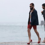 Image: Men wearing high heeled shoes walk in front of Copacabana beach during what they said was ‘an artistic’ protest ahead of Pope Francis’ visit to the beach in Rio de Janeiro