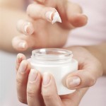 beautiful woman hands with cream