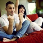 man-and-woman-watching-football-together