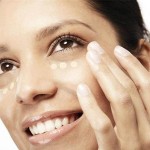 Woman applying concealer