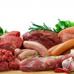 Fresh butcher cut meat assortment garnished with Salad and fresh rosemary