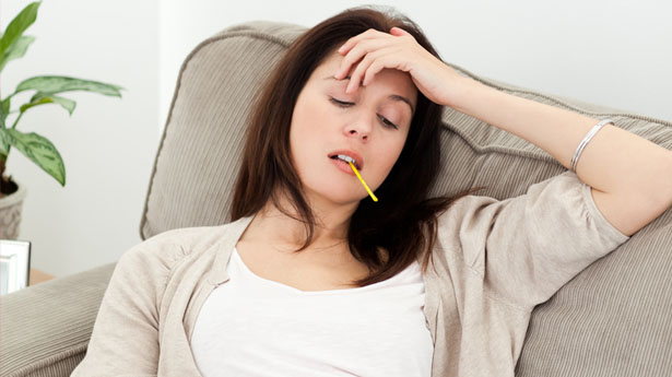 Sick-woman-with-thermometer-via-Shutterstock