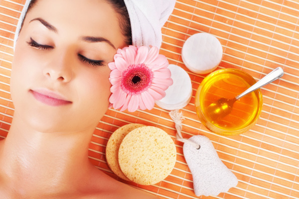 woman-enjoying-spa-treatment-with-honey