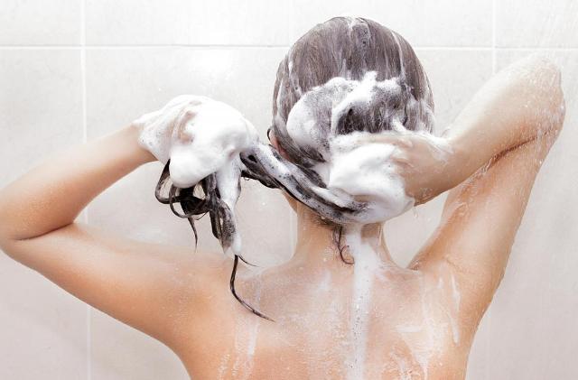 woman-washing-hair-in-shower