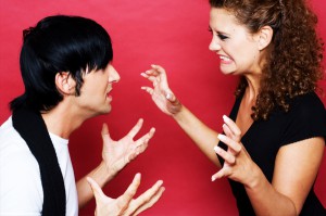 young-couple-fighting-against-red-background