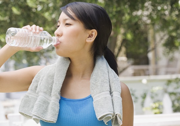 Woman drinking water from bottle